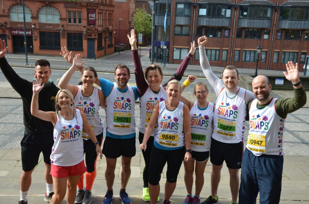 A group of runners celebrating at the Leeds half marathon